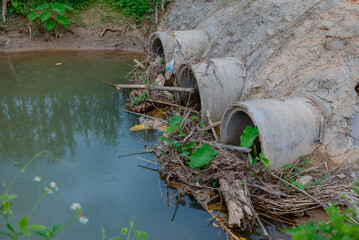 The remains of branches blocking the waterway.