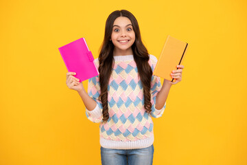 Schoolgirl with copy book posing on isolated background. Literature lesson, grammar school....