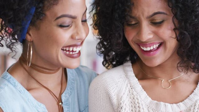 Girl Friends, Sisters And Identical Twins Looking At Social Media Or Funny Pictures. Happy Woman And Twin Sister With Curly Hair From Brazil, Women Smile And Laugh Together In Office Or Library.