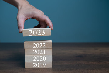 Hand with 2023 year, Happy New year with copy space for text, Resolution, time, plan, goal,...