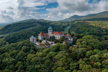 Fototapeta na wymiar view of Smolenice Castle in the Little Carpathians in green late summer forest