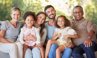 Portrait family, interracial smile and grandparents happy on living room sofa with children, smile...