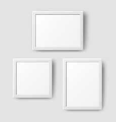 Realistic Empty Wall Photo Frame set. Vector white picture frames collage mockup template with shadow on grey wall background. Mockup for poster, banner, photo gallery, painting design, presentation.