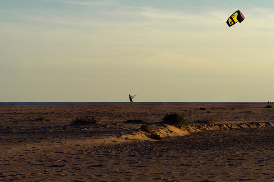 kite surfing on the beach, at the sunset, Vendée, France