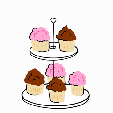 Two-tier serving tray with cupcakes. Plate with sweet dessert.