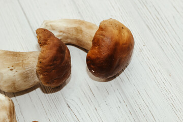 Boletus edulis on a table made of white boards preparation for eating.