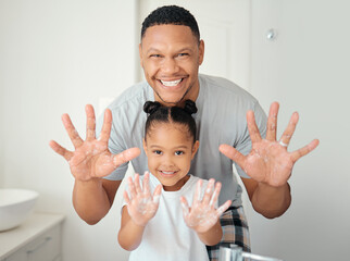 Black family with soap on hands in bathroom for bacteria cleaning safety, learning or teaching hygiene healthcare portrait. Wellness father showing girl child how to wash germs with foam for skincare