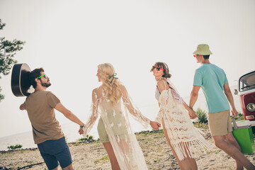 Photo of friends in love enjoy perfect hippie weekend walk see sunset wear casual outfit nature seaside beach outdoors
