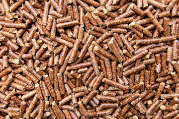 Wood pellets biofuel from mixed decidouos forest, Natural pile of wood pellets,Organic biofuels texture,Eco-friendly renewable organic biofuel.