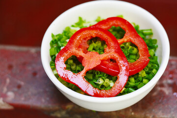 Spicy rocoto pepper with cut green onions.