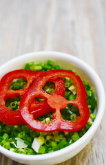 Spicy rocoto pepper with cut green onions.