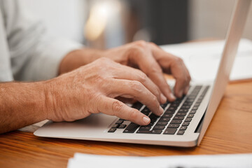Senior hands, laptop and typing email, online web search or writing article using computer keyboard at home. Closeup man, freelancer or remote worker using information technology with wifi connection