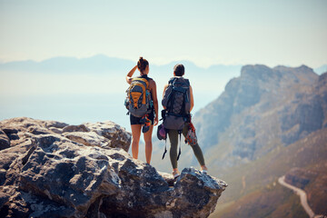 Nature, travel and hiking friends on mountain landscape with fitness, wellness and workout in summer. Freedom, rock sport or couple with backpack, health and sports exercise or training