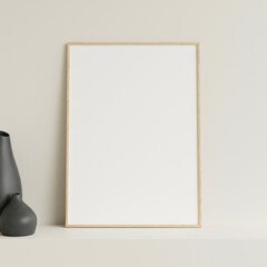 Minimalist front view vertical wooden photo or poster frame mockup leaning against wall on table with vase. 3d rendering.