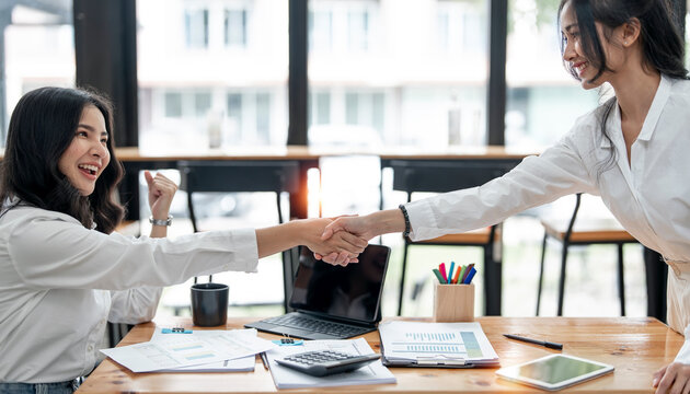 Two young Businesswoman handshake and business people. Successful business concept.