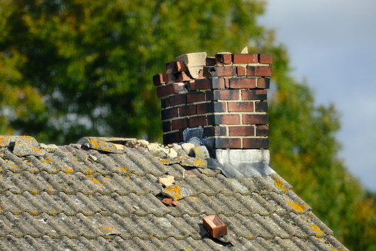 A Damaged chinmey on a roof 
