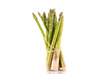 Several stems of green organic asparagus, close-up, isolated on white.