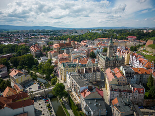 Fototapeta na wymiar Kłodzko - a city situated in the mountains. Sunny day and clouds in the blue sky in the mountains.