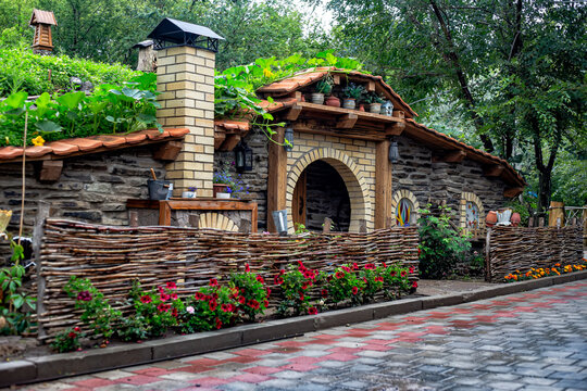 beautiful scenery, reminiscent of the hobbit house from the famous movie. Gnome near the wooden door