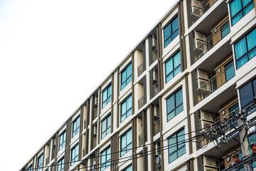 Fototapeta premium Modern condominium building glass window low rise real etate