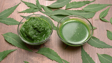 Neem leaves used as ayurvedic medicine with ground neem paste and juice Used in skin care, beauty products and creams.