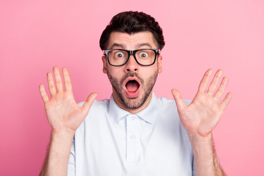 Closeup photo of young funny attractive handsome bearded guy wear eyeglasses palms up ten number shocked isolated on bright pink color background