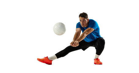 Dynamic portrait of male volleyball player training with ball isolated on white studio background....