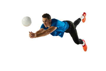 Flying. Dynamic portrait of male volleyball player training with ball isolated on white studio background. Sport, gym, team sport, challenges