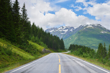 Road mountain, highway and countryside environment with freedom for travel, summer snow in Alaska...