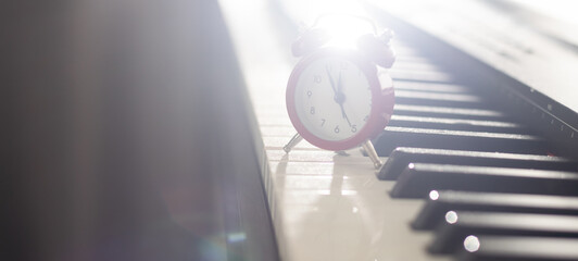alarm clock on piano, synthesizer