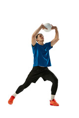 Dynamic portrait of male volleyball player training with ball isolated on white studio background. Sport, gym, team sport, challenges