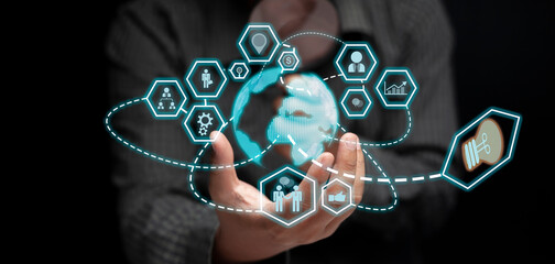 businessman's hand Show the concept of business technology in the communication world and work together as an organization through world-class technology.