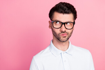 Obraz premium Closeup photo of young handsome funny positive interested guy wear white polo pouted lips distrust look empty space idea isolated on pink color background