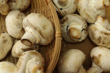Champignon mushrooms on wood background