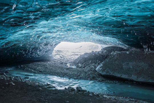 Blue ice cave in glacier - Powered by Adobe