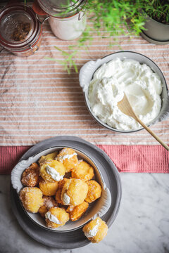 Bowl with nun's puffs cheese bites on table
