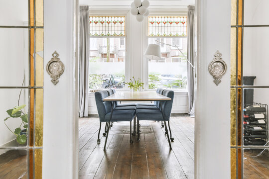 Dining table with chairs in open plan living room