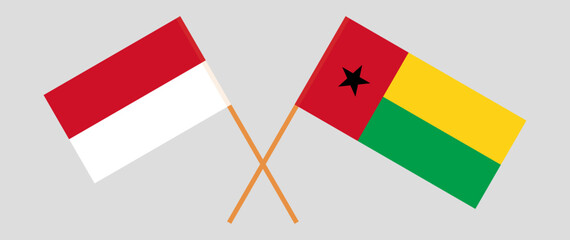 Crossed flags of Indonesia and Guinea-Bissau. Official colors. Correct proportion