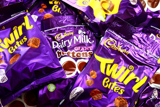 Packets of cadbury twirl,dairy milk giant buttons and caramel nibbles