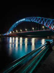 mahakam bridge is blue at night on the mahakam tenggrarong river