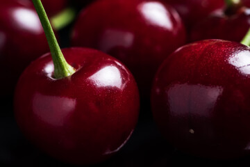 Red ripe fresh cherries in drops of water close up. Cherry background. Berry pattern and texture. Food background.