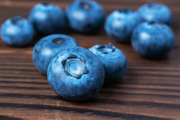 Fresh Blueberries on wooden background close up