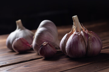 Garlic bulb on wooden background. Close up