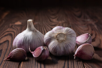 Garlic bulb on wooden background. Close up
