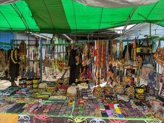 a shop selling a variety of traditional Dayak Kenyah handicraft accessories