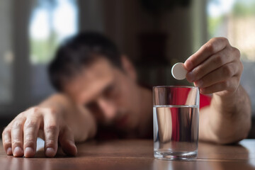 Man With Hangover Taking Medicine Pill Cure