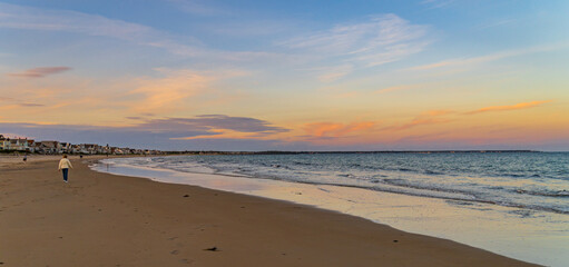 people enjoying the evening on the beach in Ogunquit, Maine 
