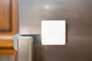 Souvenir magnets of the city on the door of the refrigerator with copy space