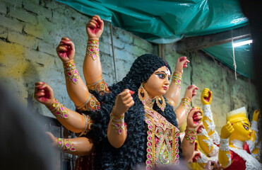 Close-up of Hindu idol goddess Durga ready to go puja mandap