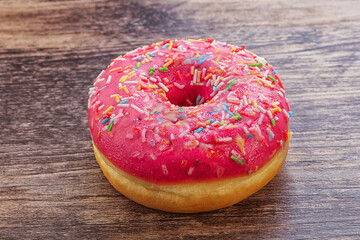 Sweet glazed struwberry donut with icing